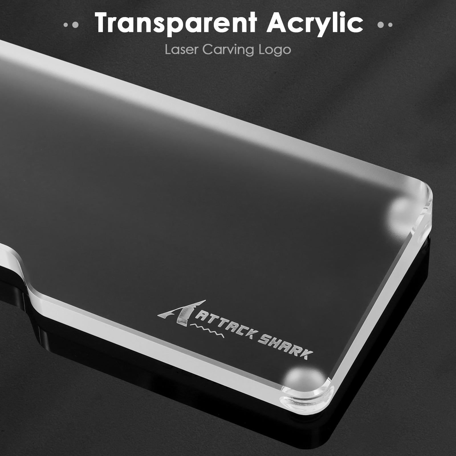 Close-up of transparent acrylic wrist rest with Attack Shark logo and laser engraving.